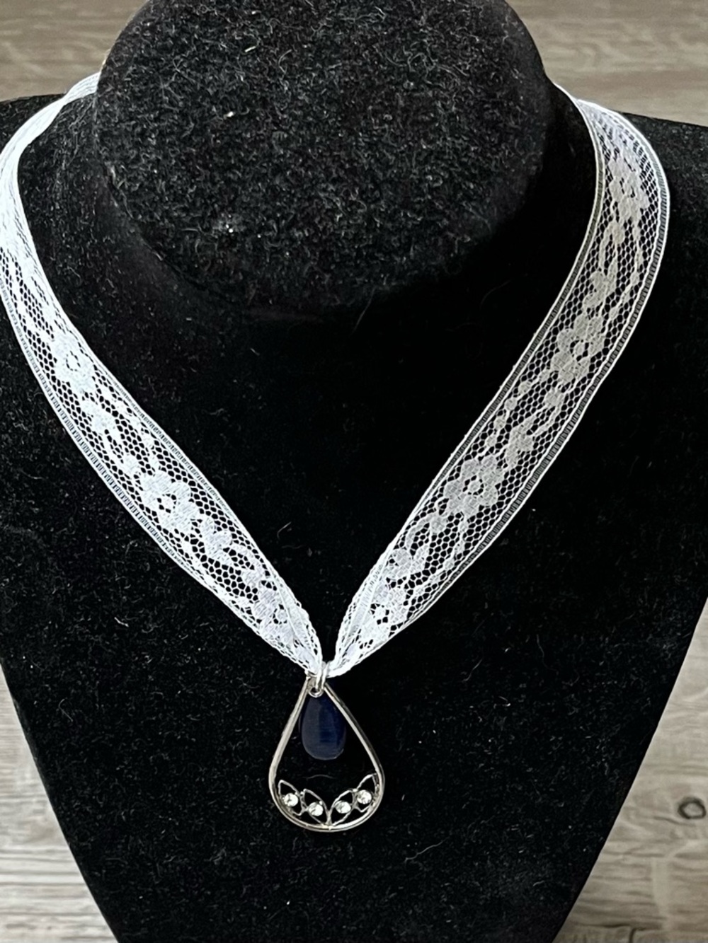 Silver Teardrop Necklace with Navy Pendant on White Lace Ribbon
